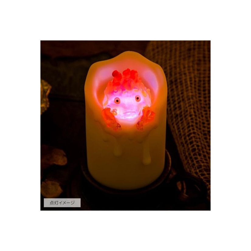 Il castello errante di Howl con Calcifer illuminato e candela da 13 cm