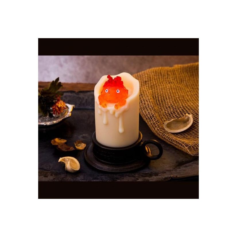 Il castello errante di Howl con Calcifer illuminato e candela da 13 cm