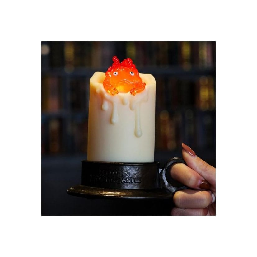 Il castello errante di Howl con Calcifer illuminato e candela da 13 cm